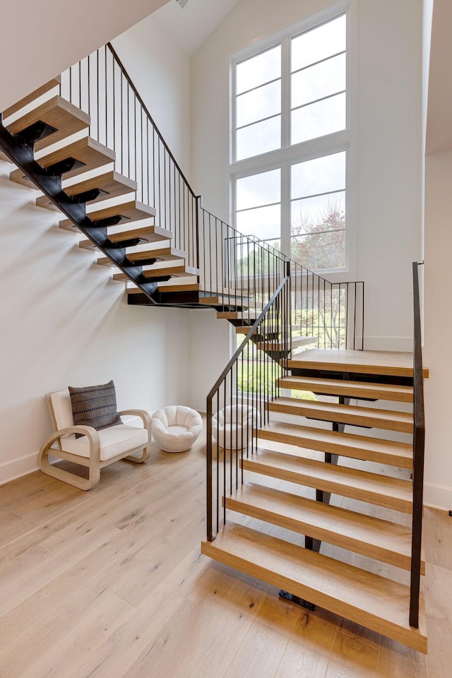 7555 Whiskey Rd, College Grove, TN 37046 - stairway with wood finished floors and a towering ceiling