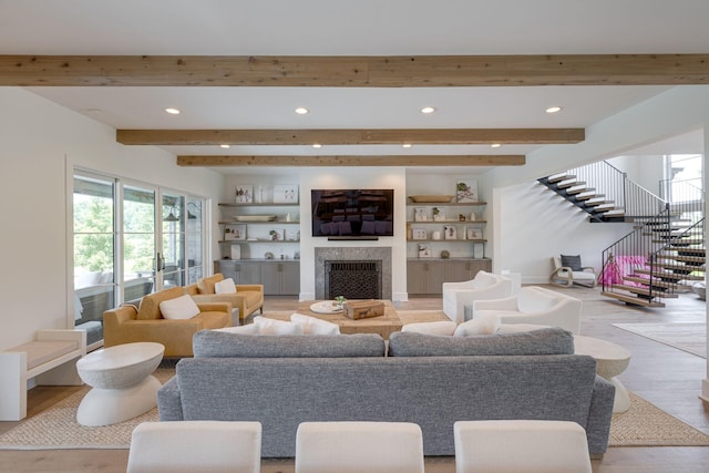 7555 Whiskey Rd, College Grove, TN 37046 - living area with recessed lighting, a fireplace, beamed ceiling, stairway, and light wood-style flooring