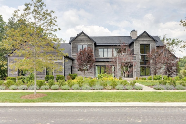 7555 Whiskey Rd, College Grove, TN 37046 - view of front facade featuring a chimney, a front lawn, and stone siding