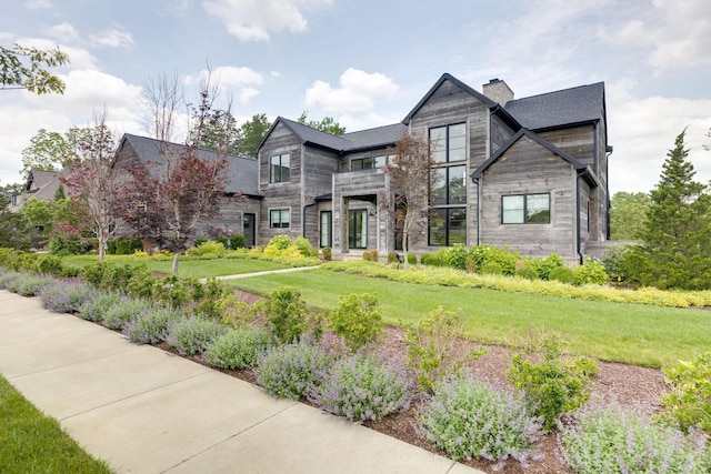 7555 Whiskey Rd, College Grove, TN 37046 - contemporary home with a chimney, a front lawn, a balcony, and stone siding