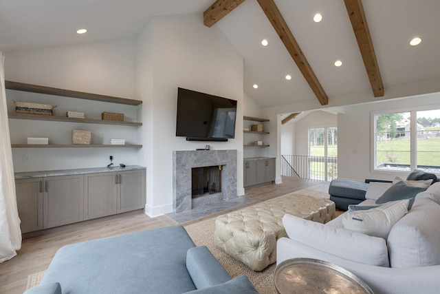 7555 Whiskey Rd, College Grove, TN 37046 - living area with recessed lighting, beam ceiling, light wood-type flooring, high vaulted ceiling, and a fireplace