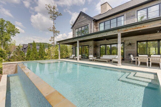 7555 Whiskey Rd, College Grove, TN 37046 - swimming pool featuring an outdoor living space, a ceiling fan, and a patio