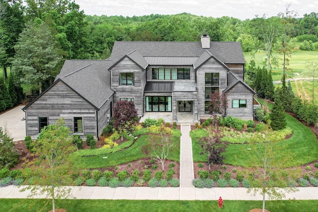 7555 Whiskey Rd, College Grove, TN 37046 - contemporary home featuring a chimney