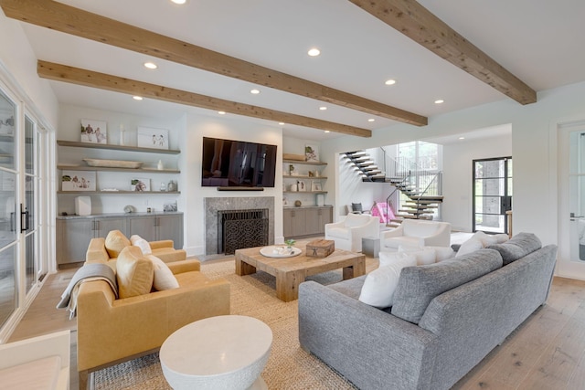7555 Whiskey Rd, College Grove, TN 37046 - living room with stairs, recessed lighting, light wood-style flooring, beamed ceiling, and a fireplace
