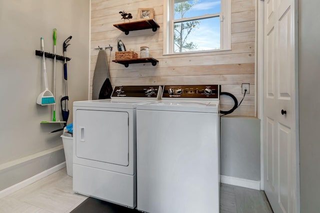 4985 Shihmen Dr, Antioch, TN 37013 - washroom featuring washer and clothes dryer and wood walls