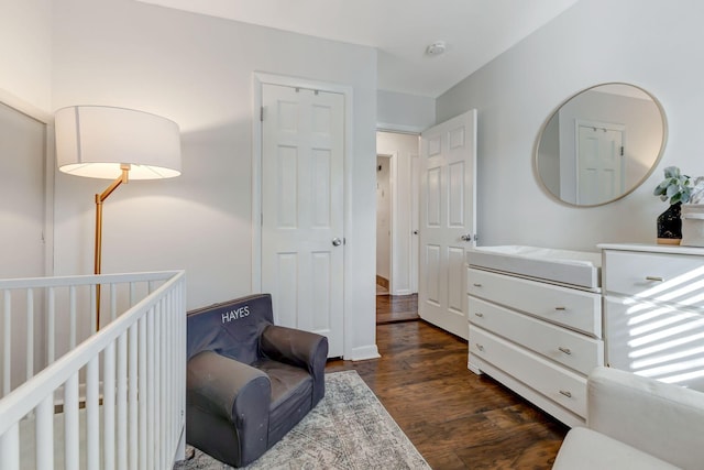 4985 Shihmen Dr, Antioch, TN 37013 - bedroom featuring dark wood-style floors and a nursery area