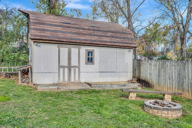 4985 Shihmen Dr, Antioch, TN 37013 - view of shed with a fire pit and a fenced backyard