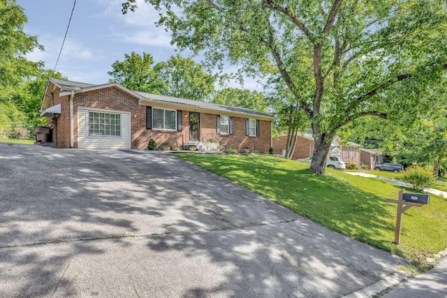 4985 Shihmen Dr, Antioch, TN 37013 - single story home with brick siding, asphalt driveway, and a front yard