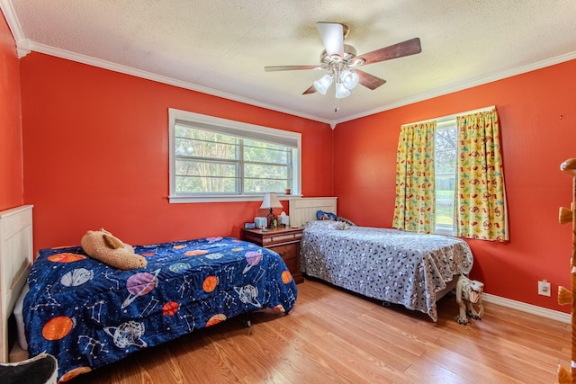996 Matrose Carrolls Rd, Michie, TN 38357 - bedroom featuring wood finished floors, ornamental molding, a textured ceiling, and ceiling fan