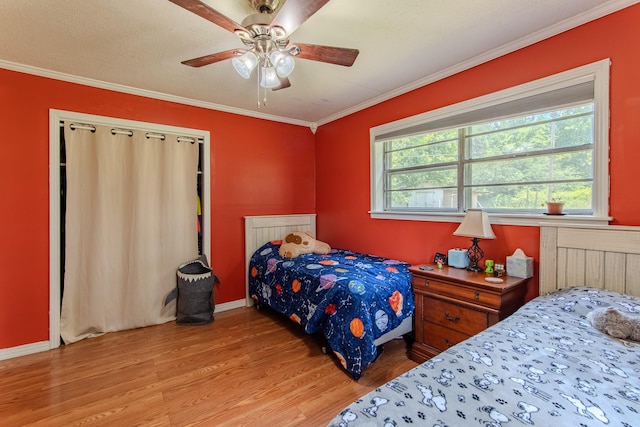 996 Matrose Carrolls Rd, Michie, TN 38357 - bedroom featuring light wood-style flooring, crown molding, and a ceiling fan