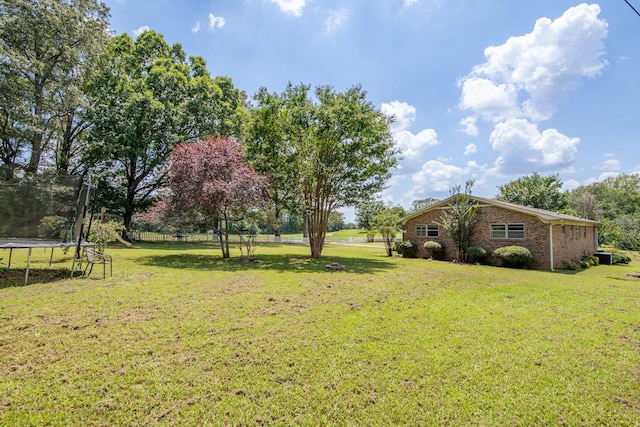996 Matrose Carrolls Rd, Michie, TN 38357 - view of grassy yard featuring a trampoline