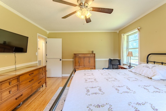 996 Matrose Carrolls Rd, Michie, TN 38357 - bedroom with light wood-style flooring, crown molding, and ceiling fan