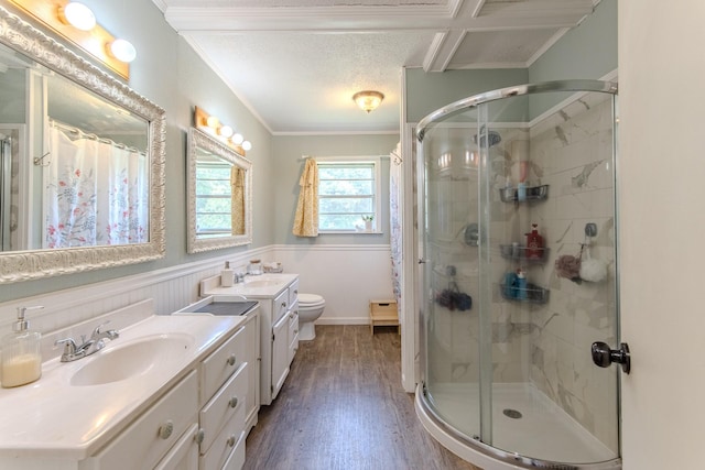 996 Matrose Carrolls Rd, Michie, TN 38357 - full bathroom with a stall shower, vanity, wood finished floors, ornamental molding, and wainscoting