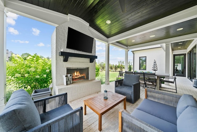 8869 Edgecomb Dr, College Grove, TN 37046 - view of patio with an outdoor living space with a fireplace and outdoor dining area