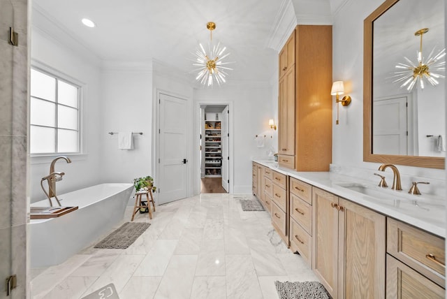8869 Edgecomb Dr, College Grove, TN 37046 - bathroom with double vanity, a freestanding tub, a walk in closet, a chandelier, and crown molding