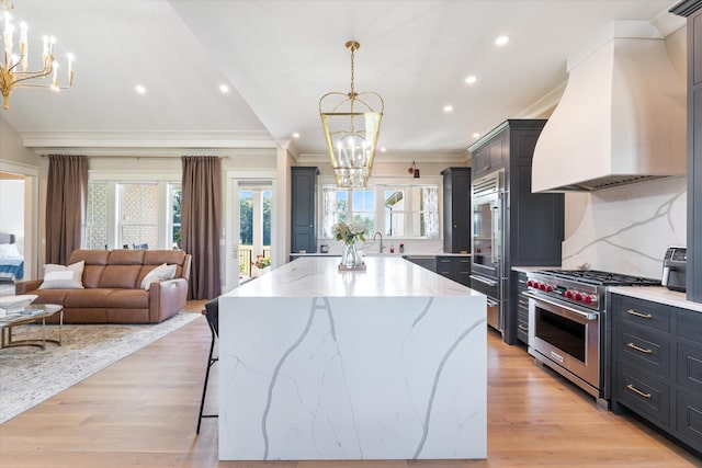 2157 Abiff Rd, Burns, TN 37029 - kitchen featuring a chandelier, high quality appliances, premium range hood, ornamental molding, and recessed lighting