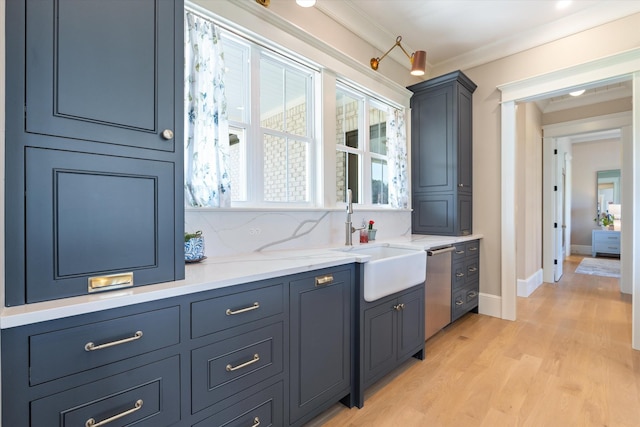 2157 Abiff Rd, Burns, TN 37029 - kitchen with crown molding, light wood finished floors, backsplash, light stone counters, and stainless steel dishwasher