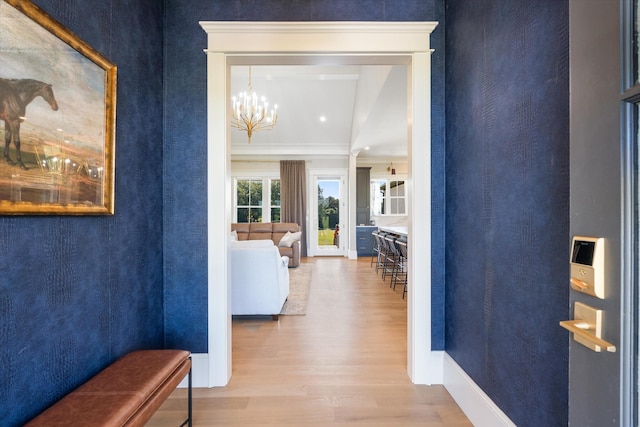 2157 Abiff Rd, Burns, TN 37029 - hall featuring wood finished floors, crown molding, and a chandelier