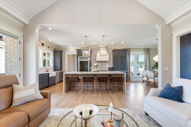 2157 Abiff Rd, Burns, TN 37029 - living room featuring vaulted ceiling, light wood-style flooring, recessed lighting, ornamental molding, and a chandelier