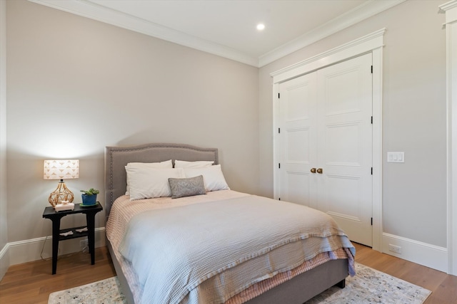 2157 Abiff Rd, Burns, TN 37029 - bedroom featuring light wood-style flooring, crown molding, a closet, and recessed lighting
