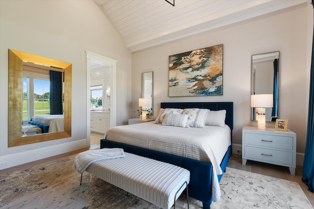 2157 Abiff Rd, Burns, TN 37029 - bedroom featuring vaulted ceiling, wood finished floors, and ensuite bathroom