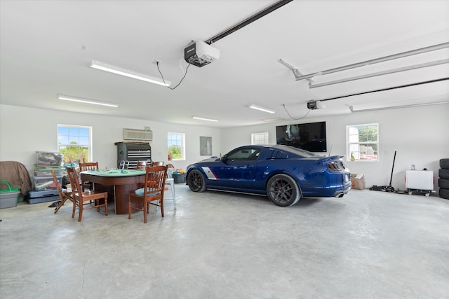 2157 Abiff Rd, Burns, TN 37029 - garage featuring a garage door opener and electric panel
