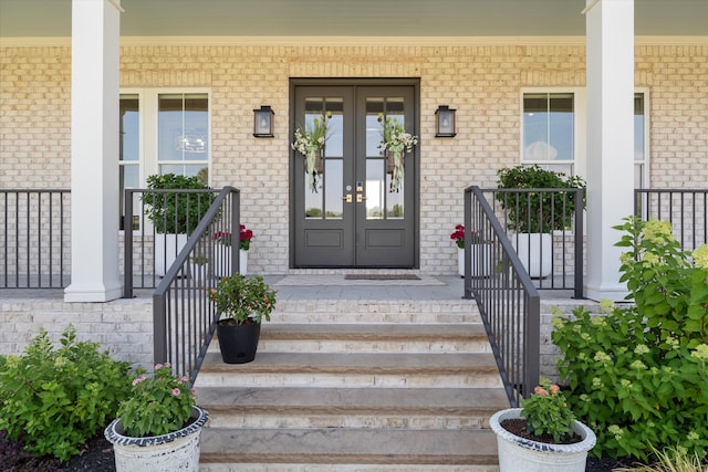2157 Abiff Rd, Burns, TN 37029 - entrance to property with covered porch, french doors, and brick siding