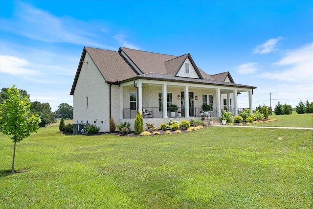 2157 Abiff Rd, Burns, TN 37029 - view of front of property with a porch, a front lawn, and brick siding