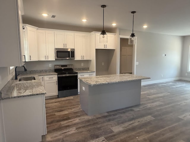 7 Willow Way, Mcminnville, TN 37110 - kitchen featuring stainless steel appliances, dark wood-style floors, a center island, white cabinets, and recessed lighting