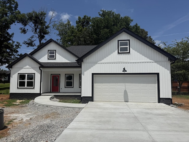 7 Willow Way, Mcminnville, TN 37110 - modern inspired farmhouse with a shingled roof, a garage, concrete driveway, and covered porch