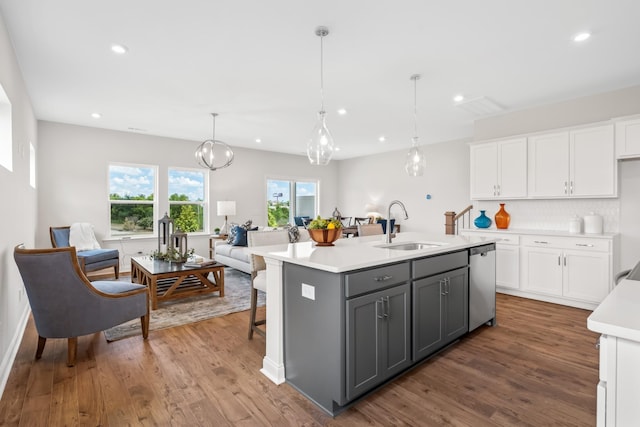 2208 Melk Ln, Columbia, TN 38401 - kitchen with stainless steel dishwasher, gray cabinetry, white cabinetry, light countertops, and wood finished floors