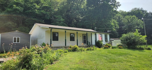 2877 Bryant Rd, Culleoka, TN 38451 - single story home with a porch, a front yard, and a storage shed