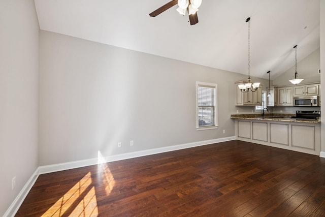 1037 Irish Way, Spring Hill, TN 37174 - kitchen with stainless steel microwave, vaulted ceiling, black electric range, a chandelier, and dark wood finished floors
