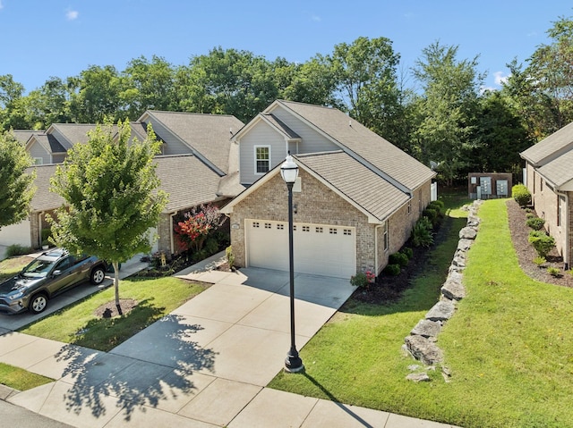 1037 Irish Way, Spring Hill, TN 37174 - traditional home featuring brick siding, an attached garage, a front yard, concrete driveway, and roof with shingles