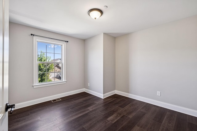 1037 Irish Way, Spring Hill, TN 37174 - spare room featuring dark wood-style flooring and baseboards