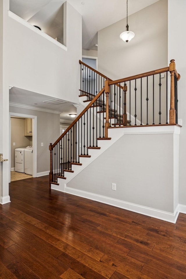 1037 Irish Way, Spring Hill, TN 37174 - stairway featuring independent washer and dryer, a high ceiling, hardwood / wood-style floors, and crown molding