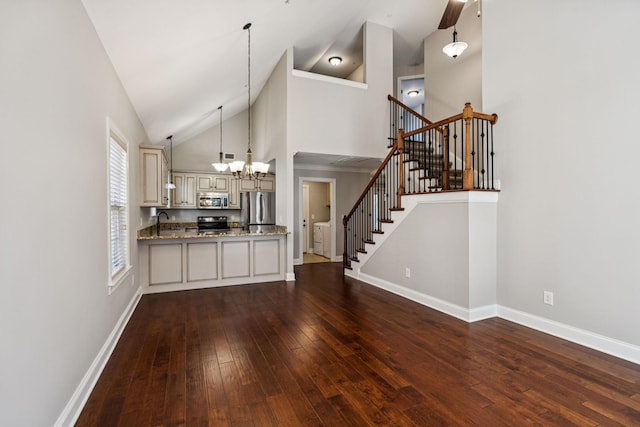 1037 Irish Way, Spring Hill, TN 37174 - kitchen featuring appliances with stainless steel finishes, cream cabinetry, a chandelier, high vaulted ceiling, and dark wood finished floors