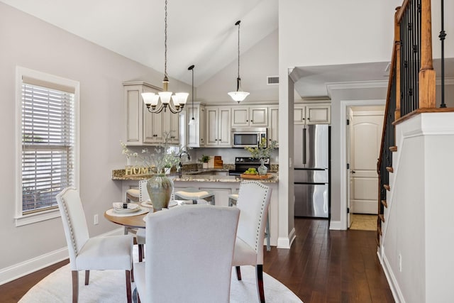 1037 Irish Way, Spring Hill, TN 37174 - dining room featuring dark wood-type flooring, a chandelier, stairway, and lofted ceiling