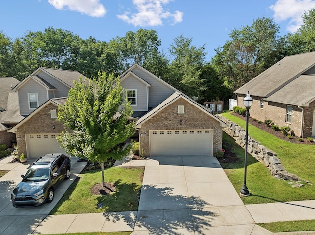 1037 Irish Way, Spring Hill, TN 37174 - view of front of property with brick siding, driveway, an attached garage, and a front yard