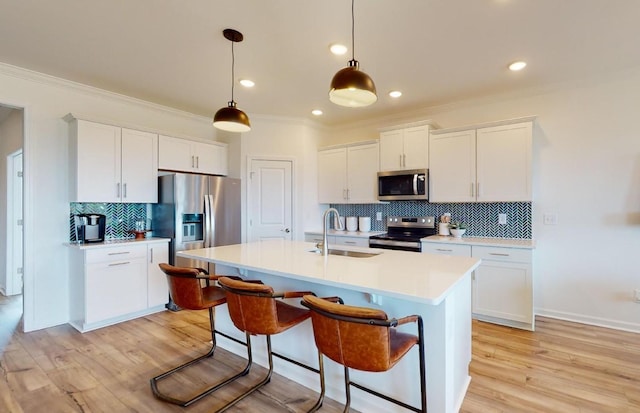 462 Jet Stream Dr, La Vergne, TN 37086 - kitchen featuring appliances with stainless steel finishes, tasteful backsplash, crown molding, light countertops, and white cabinets