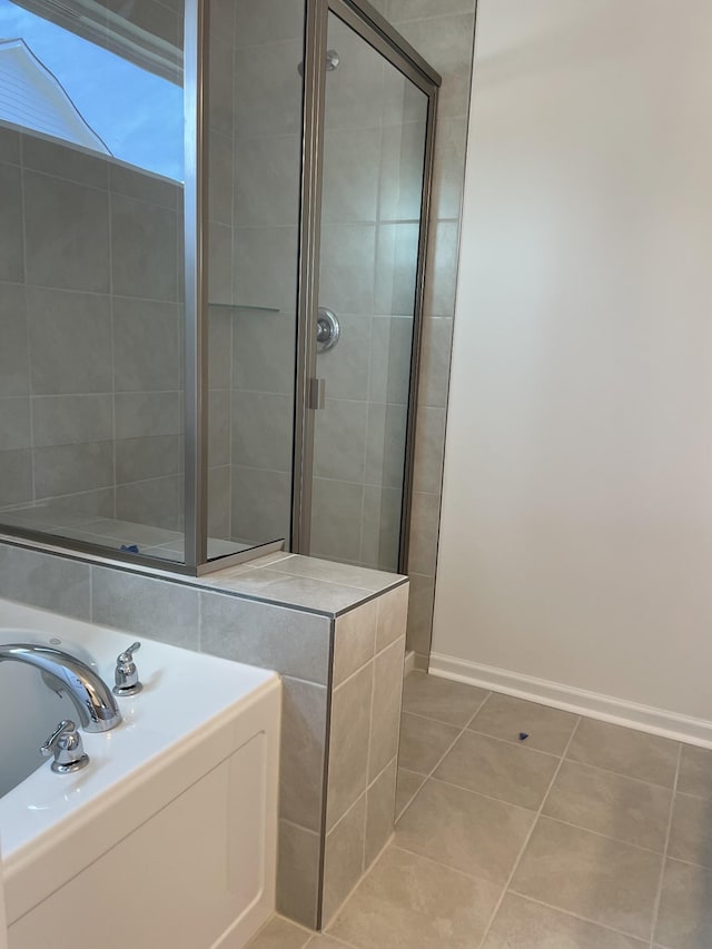 462 Jet Stream Dr, La Vergne, TN 37086 - full bath featuring a tile shower, tile patterned flooring, and a garden tub
