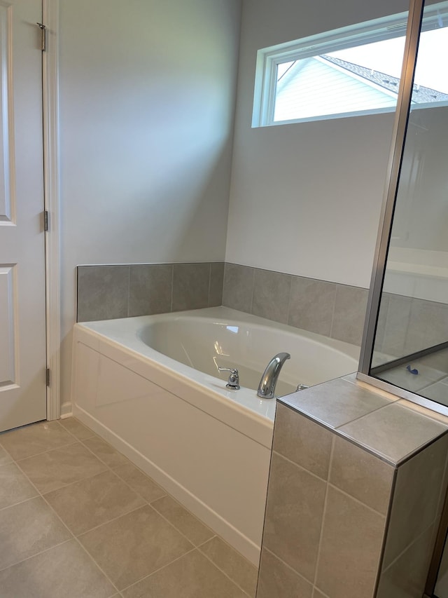 462 Jet Stream Dr, La Vergne, TN 37086 - bathroom with a bath and tile patterned floors