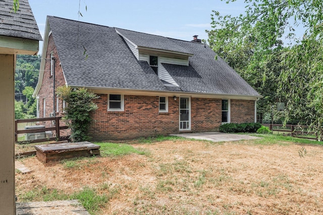 3035 Culleoka Hwy, Culleoka, TN 38451 - back of house with brick siding, roof with shingles, a patio, and a chimney