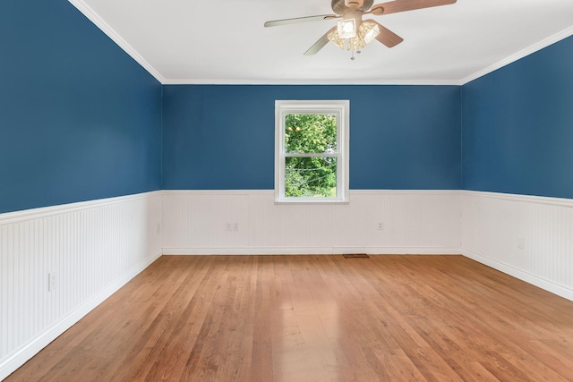 3035 Culleoka Hwy, Culleoka, TN 38451 - spare room with wood finished floors, a ceiling fan, wainscoting, and crown molding