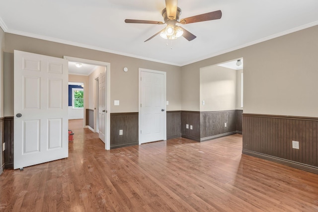 3035 Culleoka Hwy, Culleoka, TN 38451 - spare room with ceiling fan, wood finished floors, wainscoting, and crown molding