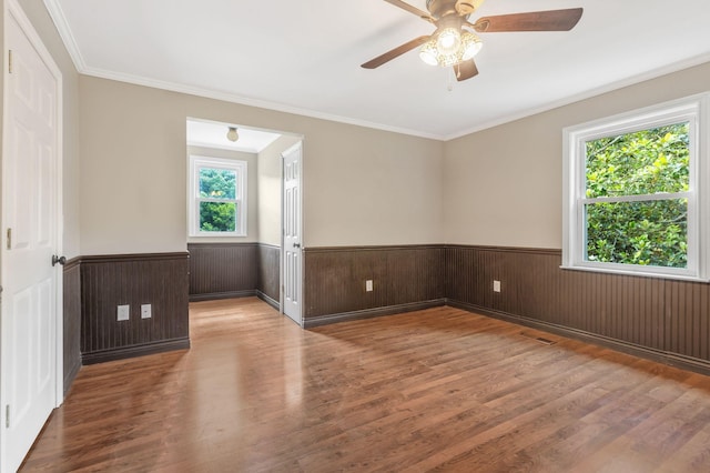 3035 Culleoka Hwy, Culleoka, TN 38451 - unfurnished room with wainscoting, wood finished floors, ceiling fan, and ornamental molding