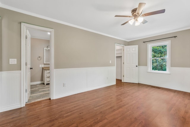 3035 Culleoka Hwy, Culleoka, TN 38451 - unfurnished room with ceiling fan, wood finished floors, wainscoting, and ornamental molding