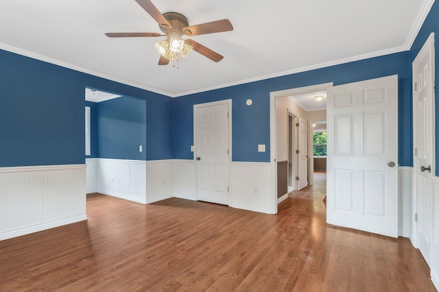 3035 Culleoka Hwy, Culleoka, TN 38451 - spare room with wainscoting, ceiling fan, wood finished floors, and ornamental molding