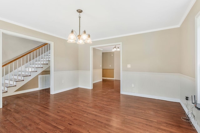 3035 Culleoka Hwy, Culleoka, TN 38451 - unfurnished room with a chandelier, stairs, wood finished floors, ornamental molding, and a wainscoted wall