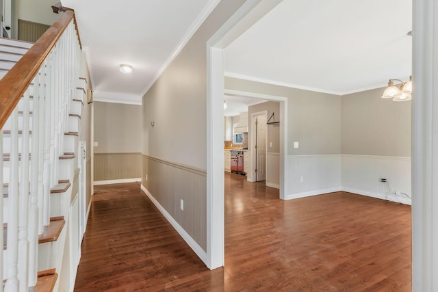 3035 Culleoka Hwy, Culleoka, TN 38451 - corridor featuring wainscoting, wood finished floors, crown molding, stairway, and a chandelier